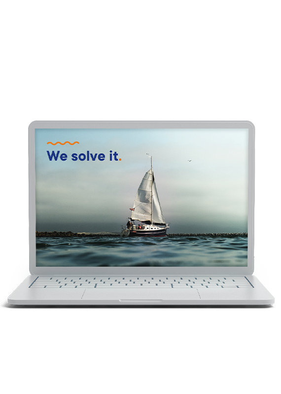 Notebook with a photo of sailboat at the sea and the phrase "We solve it."