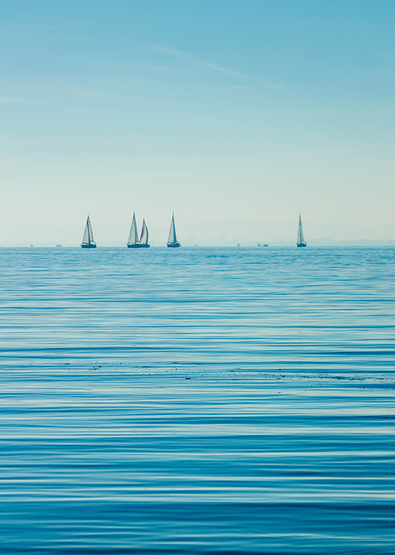 Ocean picture with sailboats far away